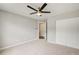 Well-lit carpeted bedroom with a ceiling fan, a closet and a neutral color scheme at 4110 Ridgebrook Bnd, Cumming, GA 30028