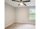 Bedroom featuring a ceiling fan, neutral carpeting, and a bright window at 4110 Ridgebrook Bnd, Cumming, GA 30028