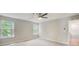 Bedroom featuring a ceiling fan, neutral carpeting, and two bright windows at 4110 Ridgebrook Bnd, Cumming, GA 30028