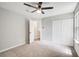 Spacious bedroom featuring plush carpeting, a ceiling fan, a closet and a neutral color scheme at 4110 Ridgebrook Bnd, Cumming, GA 30028