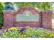 Ridgebrook community entrance sign featuring brick pillars and colorful flower beds at the base at 4110 Ridgebrook Bnd, Cumming, GA 30028