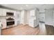 Spacious kitchen features stainless steel appliances, white cabinets, and modern flooring at 4110 Ridgebrook Bnd, Cumming, GA 30028