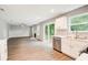 Modern kitchen open to living area featuring stainless appliances and bright countertops at 4110 Ridgebrook Bnd, Cumming, GA 30028