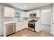 Modern kitchen features stainless steel appliances, white cabinets and a window at 4110 Ridgebrook Bnd, Cumming, GA 30028