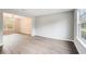 Spacious living room featuring wood-look flooring and lots of natural light at 4110 Ridgebrook Bnd, Cumming, GA 30028