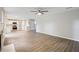 Living room features open concept view to the kitchen, modern flooring and neutral paint at 4110 Ridgebrook Bnd, Cumming, GA 30028