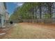 Secluded backyard with a wood fence providing privacy and shade from mature trees at 981 Sonoma Dr, Lawrenceville, GA 30045