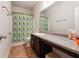 Bathroom with a shower, neutral colored tile, and a vanity area at 981 Sonoma Dr, Lawrenceville, GA 30045