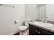 Bathroom with a toilet, mirror, and vanity area at 981 Sonoma Dr, Lawrenceville, GA 30045