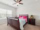 Bright bedroom with a ceiling fan, plush carpets, and a comfortable bed at 981 Sonoma Dr, Lawrenceville, GA 30045