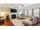 Cozy living room featuring a fireplace, built-in shelves, and plenty of natural light at 981 Sonoma Dr, Lawrenceville, GA 30045