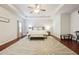 Spacious bedroom with tray ceiling and large patterned rug over the wood floor at 981 Sonoma Dr, Lawrenceville, GA 30045