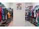 Organized walk-in closet with clothing racks and shelving at 981 Sonoma Dr, Lawrenceville, GA 30045