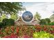 Stone community sign surrounded by a vibrant garden and lush landscaping at 986 Carl Sanders Dr, Acworth, GA 30101