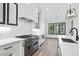 Stylish kitchen showcases marble countertops, a stainless steel range, and ample cabinet space at 986 Carl Sanders Dr, Acworth, GA 30101