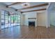 Bright living room features a fireplace, hardwood floors, and large glass doors to the outside at 986 Carl Sanders Dr, Acworth, GA 30101