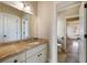 Bathroom with vanity, granite counters and a large mirror at 1865 Butlers Ln, Decatur, GA 30033