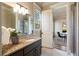 Bathroom featuring granite counters, tile flooring, and a step-in shower at 1865 Butlers Ln, Decatur, GA 30033