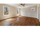 Sunlit bedroom with hardwood floors and three large windows at 1865 Butlers Ln, Decatur, GA 30033