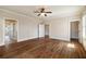 Expansive bedroom boasts hardwood floors, fan, and natural light at 1865 Butlers Ln, Decatur, GA 30033