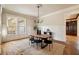 Bright dining room with a wood table, stylish chairs, and natural light from the large window at 1865 Butlers Ln, Decatur, GA 30033