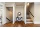 Inviting foyer with hardwood floors, staircase, and lower-level access creates a warm entrance at 1865 Butlers Ln, Decatur, GA 30033