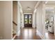 Elegant foyer featuring hardwood floors, neutral paint, and entry to adjacent living spaces at 1865 Butlers Ln, Decatur, GA 30033