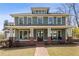 Charming two-story home with a large front porch, brick accents, and a well-manicured lawn at 1865 Butlers Ln, Decatur, GA 30033