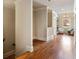 Hallway with beautiful hardwood floors leads to a cozy seating area with natural light at 1865 Butlers Ln, Decatur, GA 30033