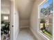 Hallway nook features a view to the yard and access to an en-suite bathroom at 1865 Butlers Ln, Decatur, GA 30033