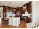 Spacious kitchen featuring a center island, custom cabinets, stainless steel appliances and hardwood floors at 1865 Butlers Ln, Decatur, GA 30033