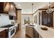 Open kitchen design with a view into the dining area, featuring white counters and stainless appliances at 1865 Butlers Ln, Decatur, GA 30033