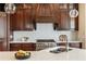 Close-up of the kitchen with white countertops, stainless steel appliances, and ample cooking space at 1865 Butlers Ln, Decatur, GA 30033