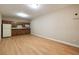 A kitchenette with wood cabinets, a white refrigerator, and a microwave at 1865 Butlers Ln, Decatur, GA 30033