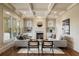 Cozy living room featuring a coffered ceiling, fireplace, built-in shelves and ample natural light at 1865 Butlers Ln, Decatur, GA 30033