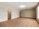 A spacious living room features hardwood floors and access to other rooms of the home at 1865 Butlers Ln, Decatur, GA 30033