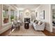 Cozy living room with a fireplace, neutral decor, and large windows for natural light at 1865 Butlers Ln, Decatur, GA 30033