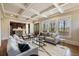 Open concept living room featuring an elegant design, fireplace, and seamless flow to the kitchen at 1865 Butlers Ln, Decatur, GA 30033