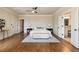 Bright main bedroom with hardwood floors, ensuite bath, and sitting area exudes elegance at 1865 Butlers Ln, Decatur, GA 30033