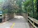 Scenic wooden walkway through lush greenery and natural landscaping at 1865 Butlers Ln, Decatur, GA 30033