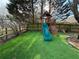 Backyard featuring a playset with slide and swings on artificial turf for  at 2585 Kirkstone Dr, Buford, GA 30519