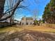 Large backyard with mature trees and ample space for outdoor activities at 2585 Kirkstone Dr, Buford, GA 30519