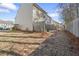 Wide view of the backyard, showcasing the layout of the backyard and a wooden fence at 2939 Greyhawk Ln, Cumming, GA 30040