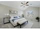 Bright bedroom with vaulted ceilings, ceiling fan, neutral walls, and a large window providing natural light at 2939 Greyhawk Ln, Cumming, GA 30040