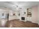 Inviting living room with a fireplace, built-in shelves, and hardwood floors at 2939 Greyhawk Ln, Cumming, GA 30040