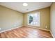 A bedroom with neutral colored walls and double-hung window at 4170 Hopkins Bluff Way, Duluth, GA 30096