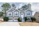 Charming two-story home with a two-car garage, landscaped yard, and traditional architectural details at 4170 Hopkins Bluff Way, Duluth, GA 30096