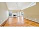 Spacious living room with hardwood floors, fireplace, a ceiling fan and natural light at 4170 Hopkins Bluff Way, Duluth, GA 30096