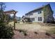 Expansive backyard showcasing an outdoor seating area, a pergola swing, and a lush lawn at 4987 Kyle Dr, Powder Springs, GA 30127