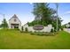 Sign for Kyle Farm neighborhood with a charming white brick building and manicured landscaping at 4987 Kyle Dr, Powder Springs, GA 30127